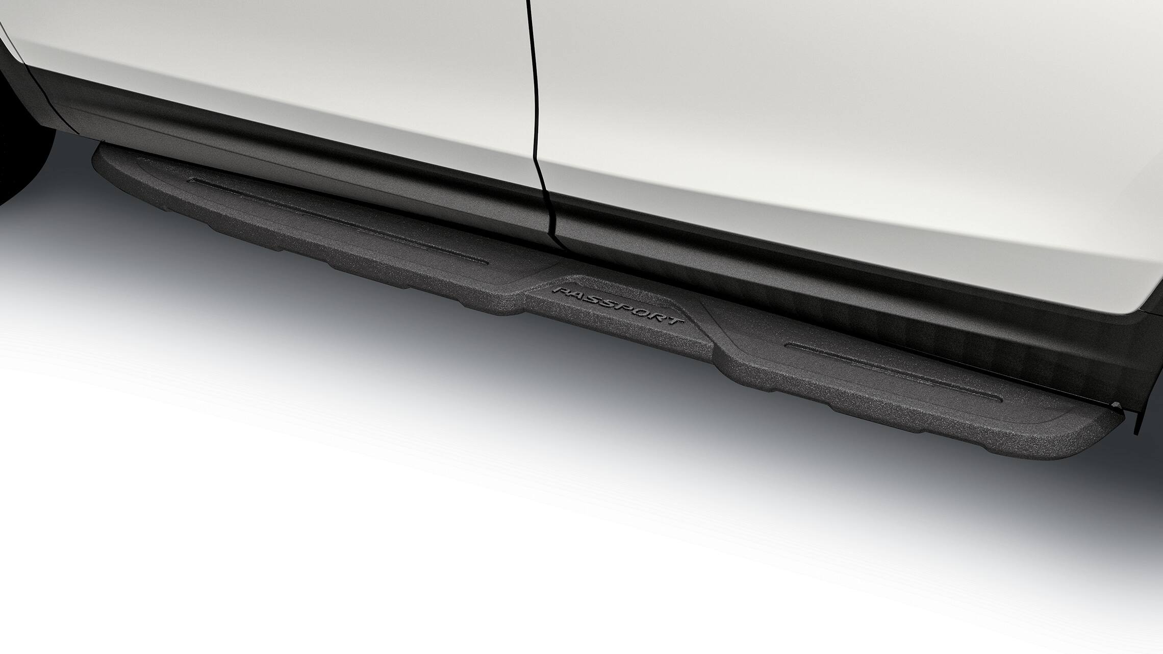 Detail of accessory die-cast running board on the 2019 Honda Passport.