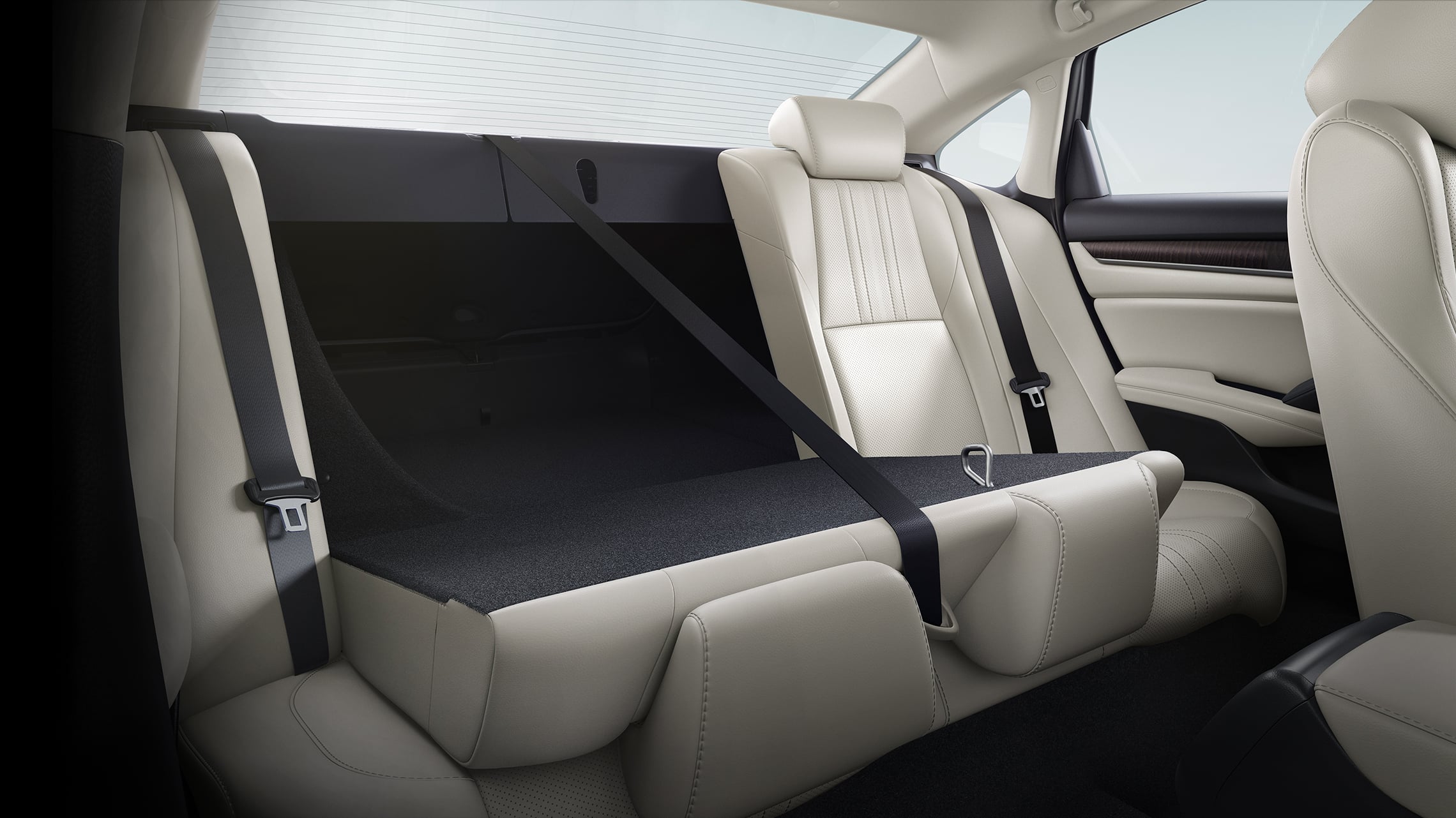 60/40 split fold-down rear seatback detail, shown partly folded down, in the 2021 Honda Accord Touring 2.0T with Ivory Leather.